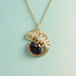 religious gold pendant with sapphire pendant gemstone accents and vintage pendant necklace craftsmanship.
