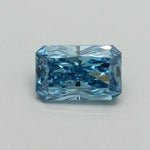 Gentle Brilliance 0.50 Ct Fancy Vivid Blue Radiant Cut Lab Grown Diamond showcasing vibrant color and sharp faceting. Ethically created with stunning clarity, this luxury statement stone offers modern elegance and rare, eye-catching beauty.