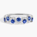 2.74 carat lab created blue sapphire engagement ring with accent diamonds in a luxury elegant design