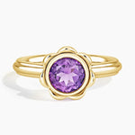 Elegant gemstone ring with vibrant center stone and sparkling accents, crafted for timeless beauty and modern style