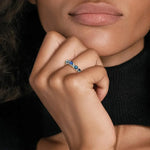 Trendy gemstone ring with baguette cut stones and modern geometric band design