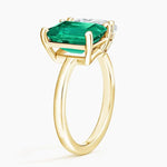Elegant gemstone ring featuring vibrant center stone with sparkling accents, perfect for engagement or daily wear