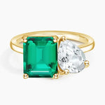 Elegant gemstone ring featuring vibrant center stone with sparkling accents, perfect for engagement or daily wear