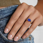 Elegant gemstone ring with blue color stone and shining white stones for luxury style