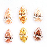 Fancy champagne and yellow pear & marquise cut lab grown diamonds, brilliant faceted loose stones for luxury jewelry design.