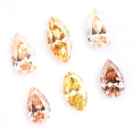 Fancy champagne and yellow pear & marquise cut lab grown diamonds, brilliant faceted loose stones for luxury jewelry design.