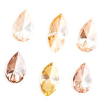 Fancy champagne and yellow pear & marquise cut lab grown diamonds, brilliant faceted loose stones for luxury jewelry design.