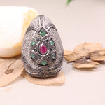Vintage ruby and emerald cocktail ring in antique style silver setting.