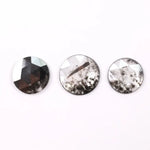 Three round rose cut lab grown salt and pepper diamonds with black and white galaxy inclusions on white background, rustic ethical conflict free loose diamonds for engagement ring or custom jewelry.
