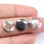 Three round rose cut lab grown salt and pepper diamonds with black and white galaxy inclusions on white background, rustic ethical conflict free loose diamonds for engagement ring or custom jewelry.