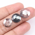 Three round rose cut lab grown salt and pepper diamonds with black and white galaxy inclusions on white background, rustic ethical conflict free loose diamonds for engagement ring or custom jewelry.