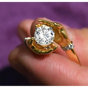 Artistic 1.5 Ct Round Lab Grown Diamond Ring in Hand-Holding Yellow and White Gold Ring