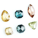 Fancy color diamond lot featuring pear, octagon, marquise and trillion mixed shape loose diamonds ideal for custom fine jewelry design, rings, pendants and luxury gemstone collections.