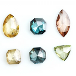 Fancy color diamond lot featuring pear, octagon, marquise and trillion mixed shape loose diamonds ideal for custom fine jewelry design, rings, pendants and luxury gemstone collections.