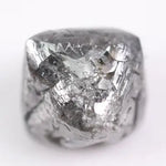 raw uncut diamond with natural rough crystal texture before cutting grey rough diamond