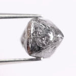raw uncut diamond with natural rough crystal texture before cutting grey rough diamond