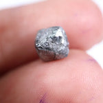 raw uncut diamond with natural rough crystal texture before cutting grey rough diamond