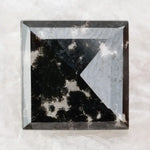 Square cut lab grown diamond with dramatic black and white salt and pepper galaxy inclusions in a geometric cut, showcasing a unique natural-looking pattern ideal for custom engagement rings or statement jewelry.
