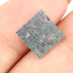 Square cut lab grown diamond with dramatic black and white salt and pepper galaxy inclusions in a geometric cut, showcasing a unique natural-looking pattern ideal for custom engagement rings or statement jewelry.