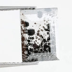 Contemporary lab grown diamond inspired crystal wall art with organic black mineral growth patterns inside a geometric mirrored frame, creating a modern reflective luxury statement piece.
