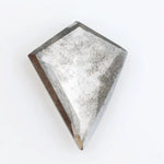 Kite-cut lab grown diamond with natural-style internal inclusions, geometric faceting, and transparent crystal body, photographed on a white background for ethical fine jewelry and custom engagement ring design.