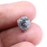 Raw uncut gray diamond showing natural crystal structure