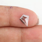 Kite-cut lab grown diamond with natural-style internal inclusions, geometric faceting, and transparent crystal body, photographed on a white background for ethical fine jewelry and custom engagement ring design.
