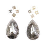 Large pear shaped salt and pepper natural diamond with dramatic black and grey inclusions paired with kite shaped accent diamonds, rustic galaxy diamond set ideal for alternative engagement ring or custom fine jewelry design.