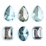 Fancy blue lab grown diamonds mix shapes including pear, oval and emerald cut loose CVD diamonds for engagement rings, custom jewelry making and fine jewelry designs with brilliant sparkle and modern sustainable luxury.