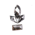 Set of natural salt and pepper diamonds with dark galaxy inclusions in mixed faceted shapes including marquise, kite and baguette cut stones for unique custom jewelry or engagement ring designs.