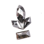 Set of natural salt and pepper diamonds with dark galaxy inclusions in mixed faceted shapes including marquise, kite and baguette cut stones for unique custom jewelry or engagement ring designs.