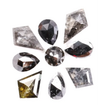 Natural salt and pepper diamonds in mixed geometric shapes including pear, kite, oval and round cuts with gray and black galaxy inclusions, loose natural diamonds for custom engagement rings and artisan jewelry design.