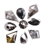 Natural salt and pepper diamonds in mixed geometric shapes including pear, kite, oval and round cuts with gray and black galaxy inclusions, loose natural diamonds for custom engagement rings and artisan jewelry design.