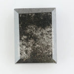 Baguette cut salt and pepper lab grown diamond with natural black inclusions, unique speckled pattern, transparent edges, ethically grown conflict free gemstone for modern jewelry