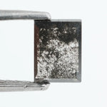 Baguette cut salt and pepper lab grown diamond with natural black inclusions, unique speckled pattern, transparent edges, ethically grown conflict free gemstone for modern jewelry