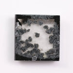 2.59 Ct black and white square cut lab grown diamond loose stone with contrasting tones and geometric shape.