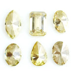 Fancy yellow lab grown loose diamonds in marquise pear oval and emerald cut shapes for luxury jewelry making