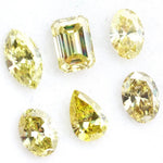 Fancy yellow lab grown loose diamonds in marquise pear oval and emerald cut shapes for luxury jewelry making
