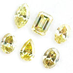 Fancy yellow lab grown loose diamonds in marquise pear oval and emerald cut shapes for luxury jewelry making