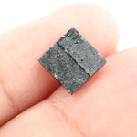 Close-up of a princess cut lab-grown diamond with square shape, sharp facets, and visible inclusions, showcasing modern geometric brilliance and ethical gemstone craftsmanship for jewelry making