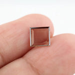 Square pyramid cut lab grown diamond with soft champagne tone, high clarity, polished facets, and modern geometric shape on a clean white background