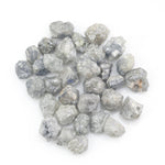 grey white natural diamond with a rugged unpolished surface for jewelry making