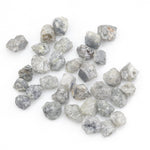 grey white natural diamond with a rugged unpolished surface for jewelry making
