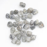 grey white natural diamond with a rugged unpolished surface for jewelry making