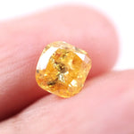 1.74 Ct yellow cushion cut lab created diamond loose stone with vibrant golden color and softly rounded square shape for custom engagement ring or luxury jewelry setting.