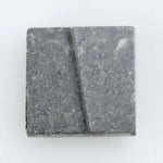 Lab grown diamond with square geometric cut featuring high contrast black and white faceting, sharp edges, and modern architectural design