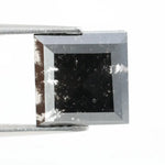 Lab grown diamond with square geometric cut featuring high contrast black and white faceting, sharp edges, and modern architectural design