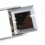 Lab grown diamond with square geometric cut featuring high contrast black and white faceting, sharp edges, and modern architectural design