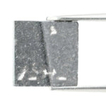 Lab grown diamond with square geometric cut featuring high contrast black and white faceting, sharp edges, and modern architectural design