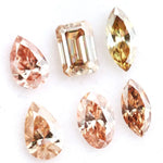 Fancy color lab grown diamond mix shape CVD loose diamonds including pear oval marquise emerald cut champagne and peach diamonds for engagement ring and custom fine jewelry making.